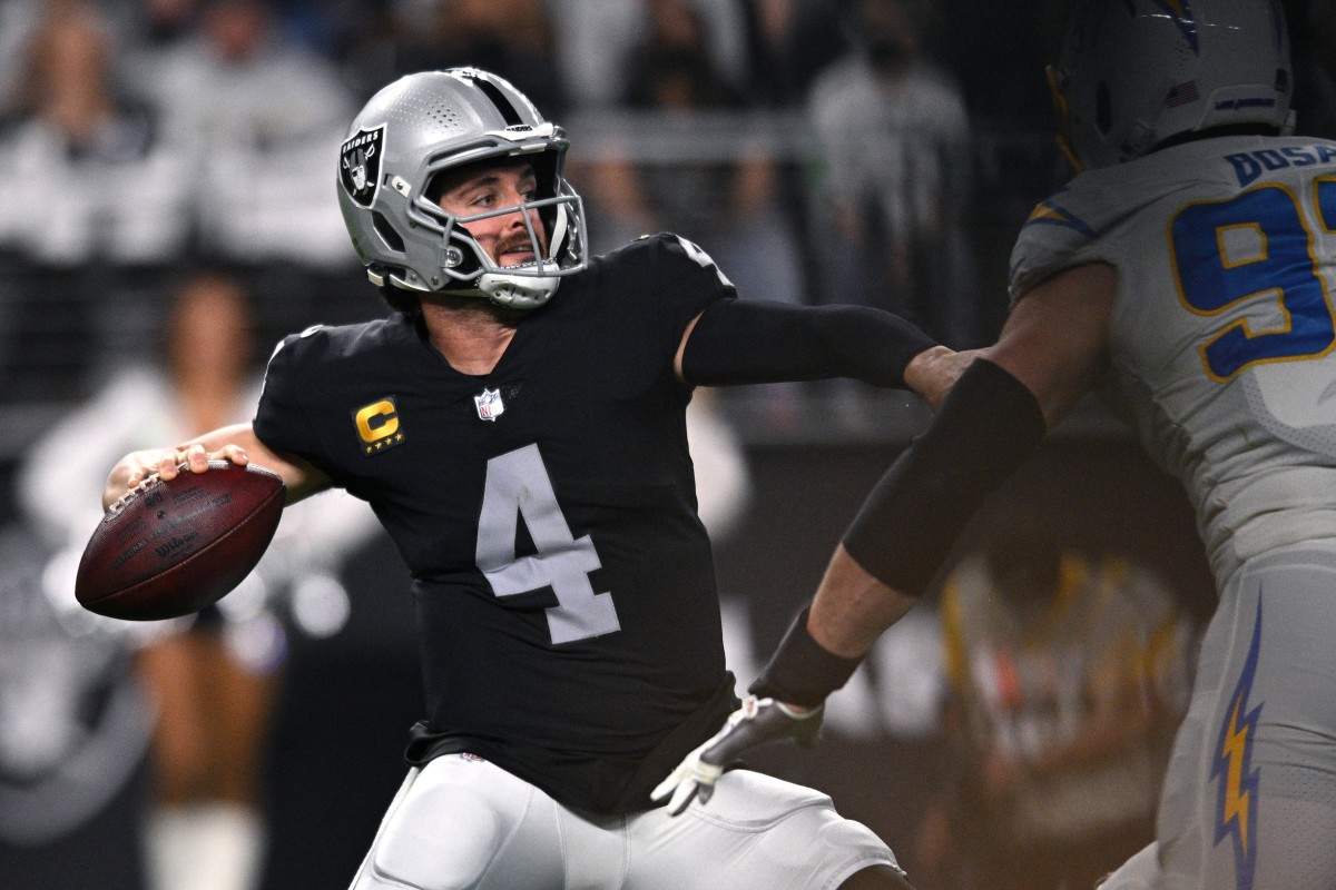 Las Vegas Raiders quarterback Derek Carr (4) throws a pass during the first half against the Los Angeles Chargers at Allegiant Stadium.