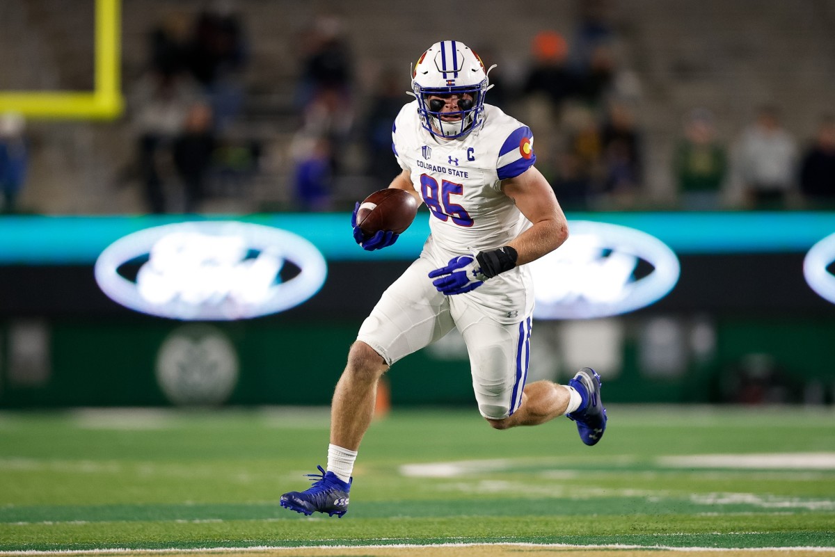 Nov 27, 2021; Fort Collins, Colorado, USA; Colorado State Rams tight end Trey McBride (85) runs the ball on a reception in the second quarter against the Nevada Wolf Pack at Sonny Lubrick Field at Canvas Stadium.