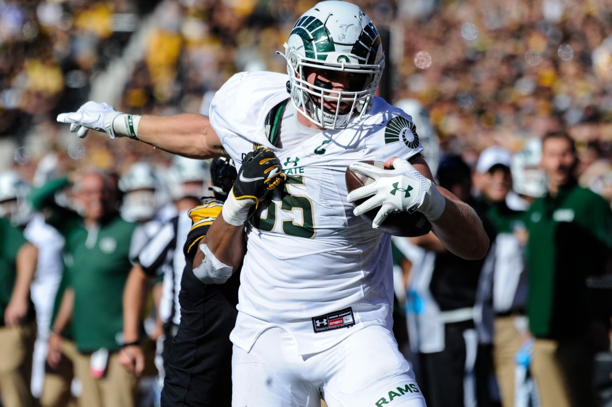 Sep 25, 2021; Iowa City, Iowa, USA; Colorado State Rams tight end Trey McBride (85) runs with the ball after a catch as Iowa Hawkeyes linebacker Jestin Jacobs (5) goes to make the tackle during the second quarter at Kinnick Stadium.