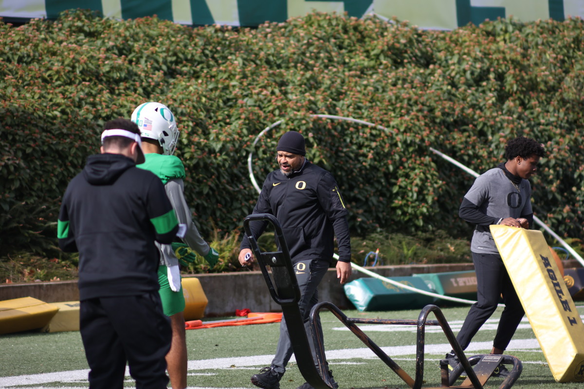 Oregon cornerbacks coach Demetrice Martin leads his group through drills at practice.