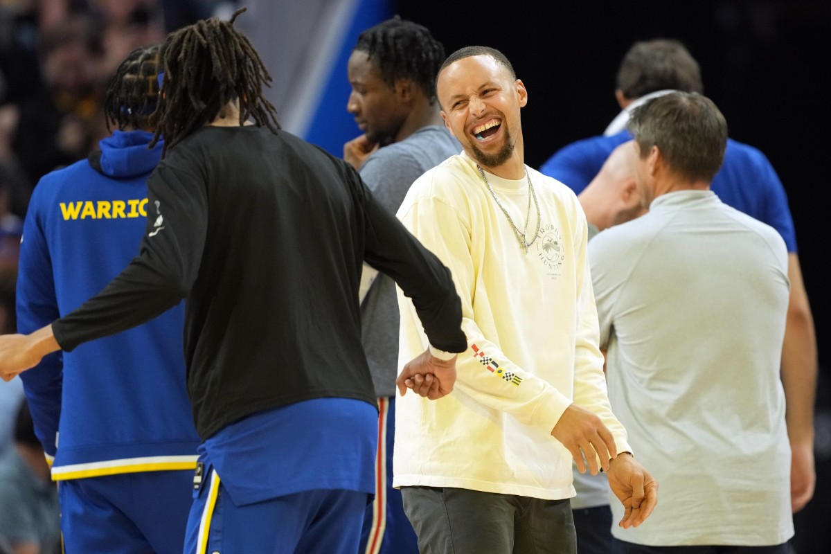 Apr 7, 2022; San Francisco, California, USA; Golden State Warriors guard Stephen Curry (30) laughs on the court during a timeout in the second quarter against the Los Angeles Lakers at Chase Center. Mandatory Credit: Darren Yamashita-USA TODAY Sports