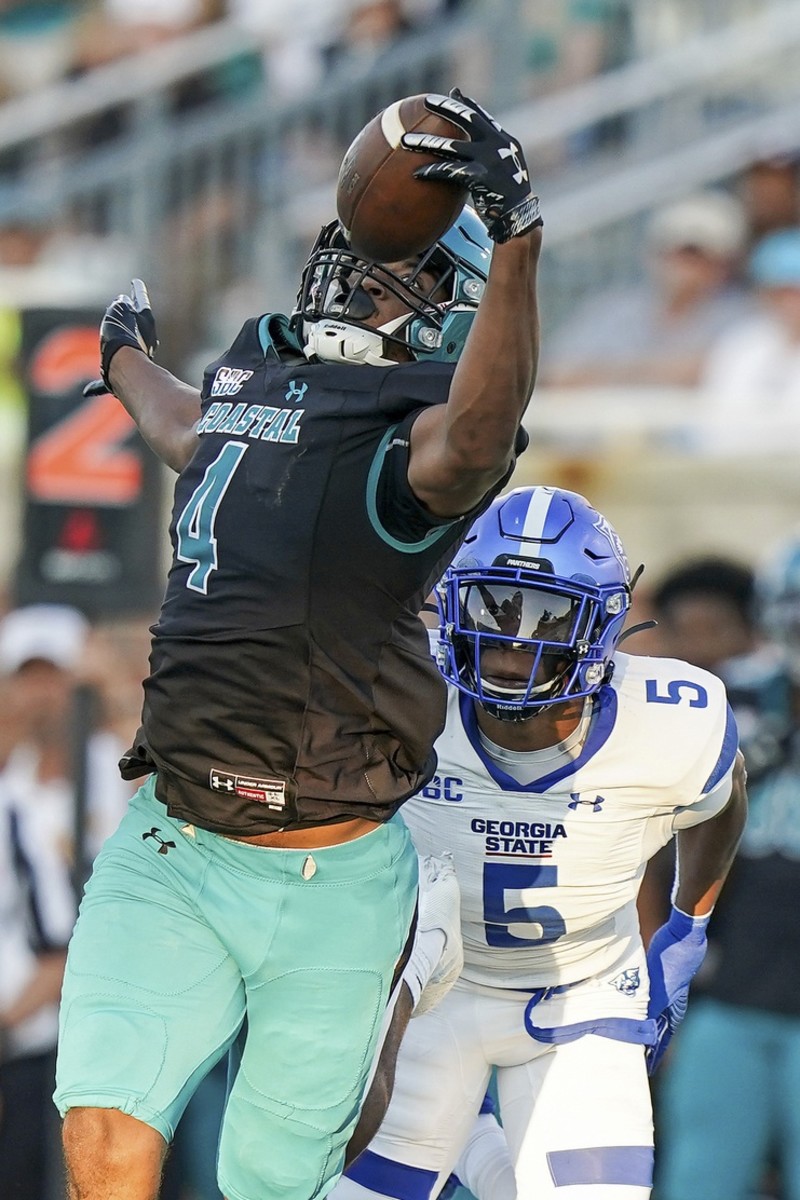Coastal Carolina Chanticleers tight end Isaiah Likely (4) makes a one handed catch over Georgia State cornerback Bryquice Brown (5). Mandatory Credit: David Yeazell-USA TODAY Sports