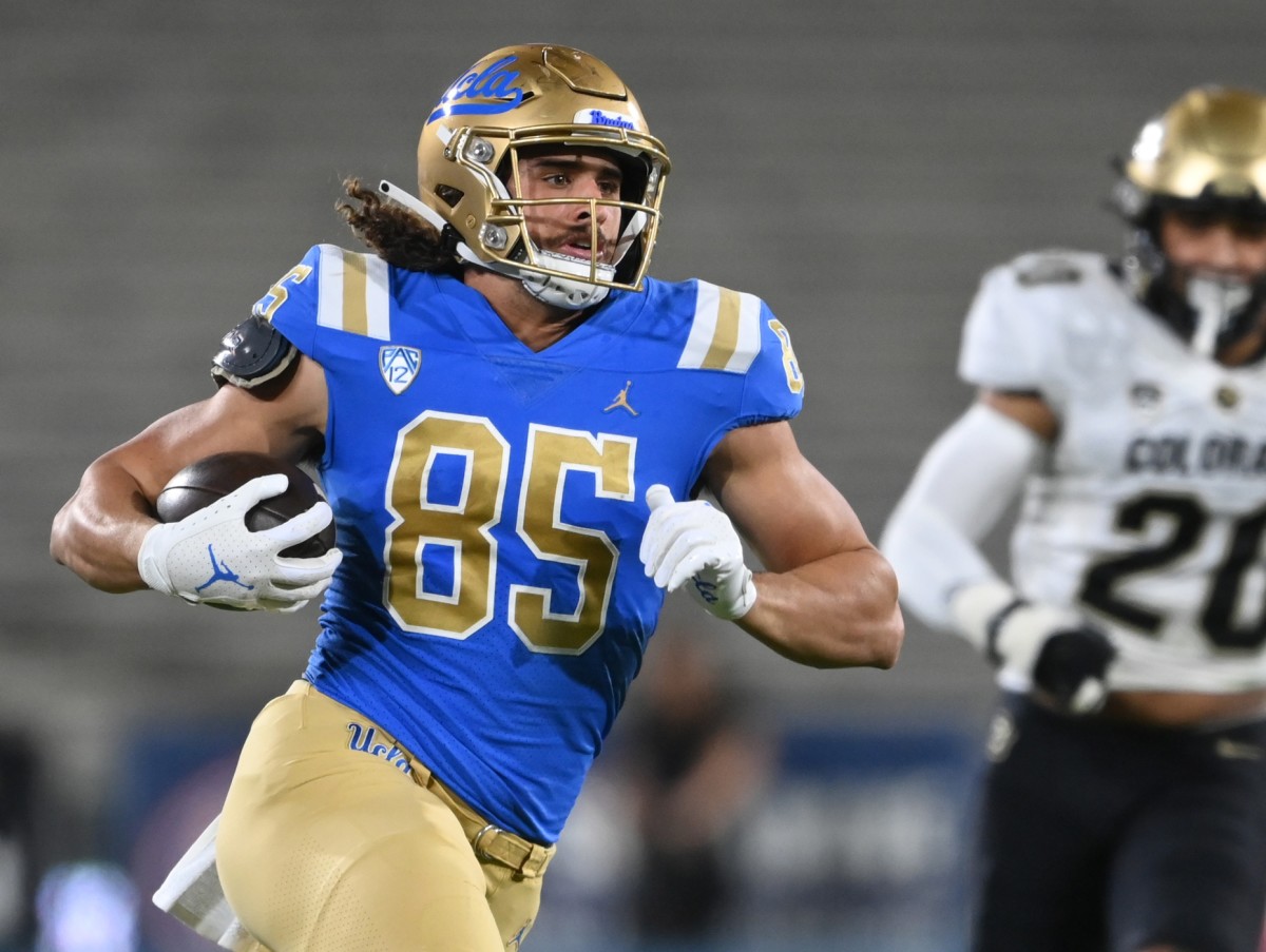 UCLA Bruins tight end Greg Dulcich (85) runs with the ball for a first down against the Colorado Buffaloes. Mandatory Credit: Jayne Kamin-Oncea-USA TODAY Sports