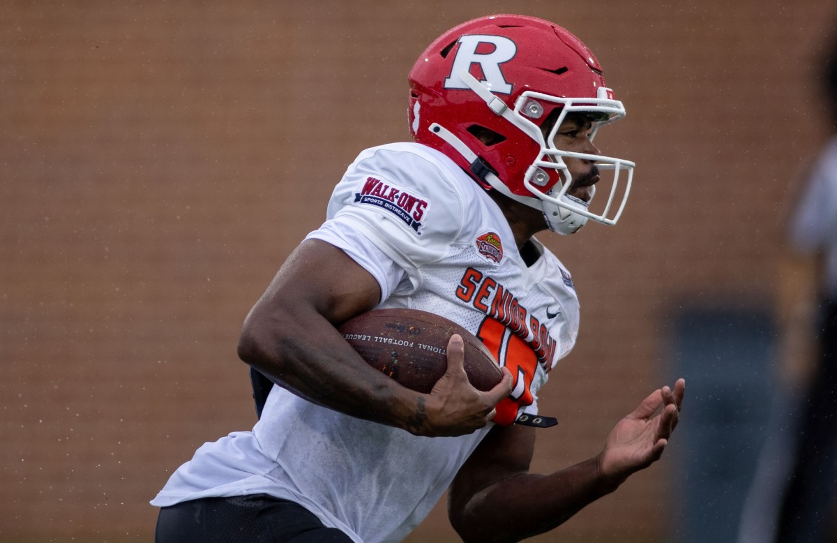 Feb 2, 2022; Mobile, AL, USA; National squad wide receiver Bo Melton of Rutgers (18) runs the ball after a catch during National team practice for the 2022 Senior Bowl at Hancock Whitney Stadium. Mandatory Credit: Vasha Hunt-USA TODAY Sports