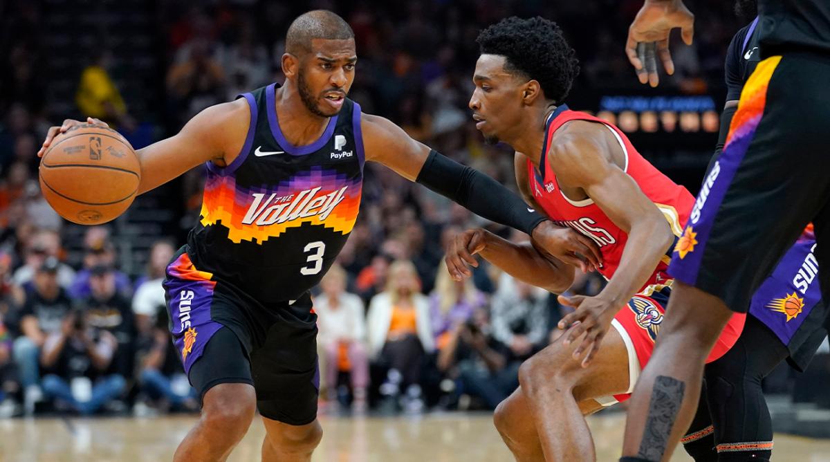 Phoenix Suns guard Chris Paul (3) drives as New Orleans Pelicans forward Herbert Jones defends during the first half of Game 1 of an NBA basketball first-round playoff series, Sunday, April 17, 2022, in Phoenix.