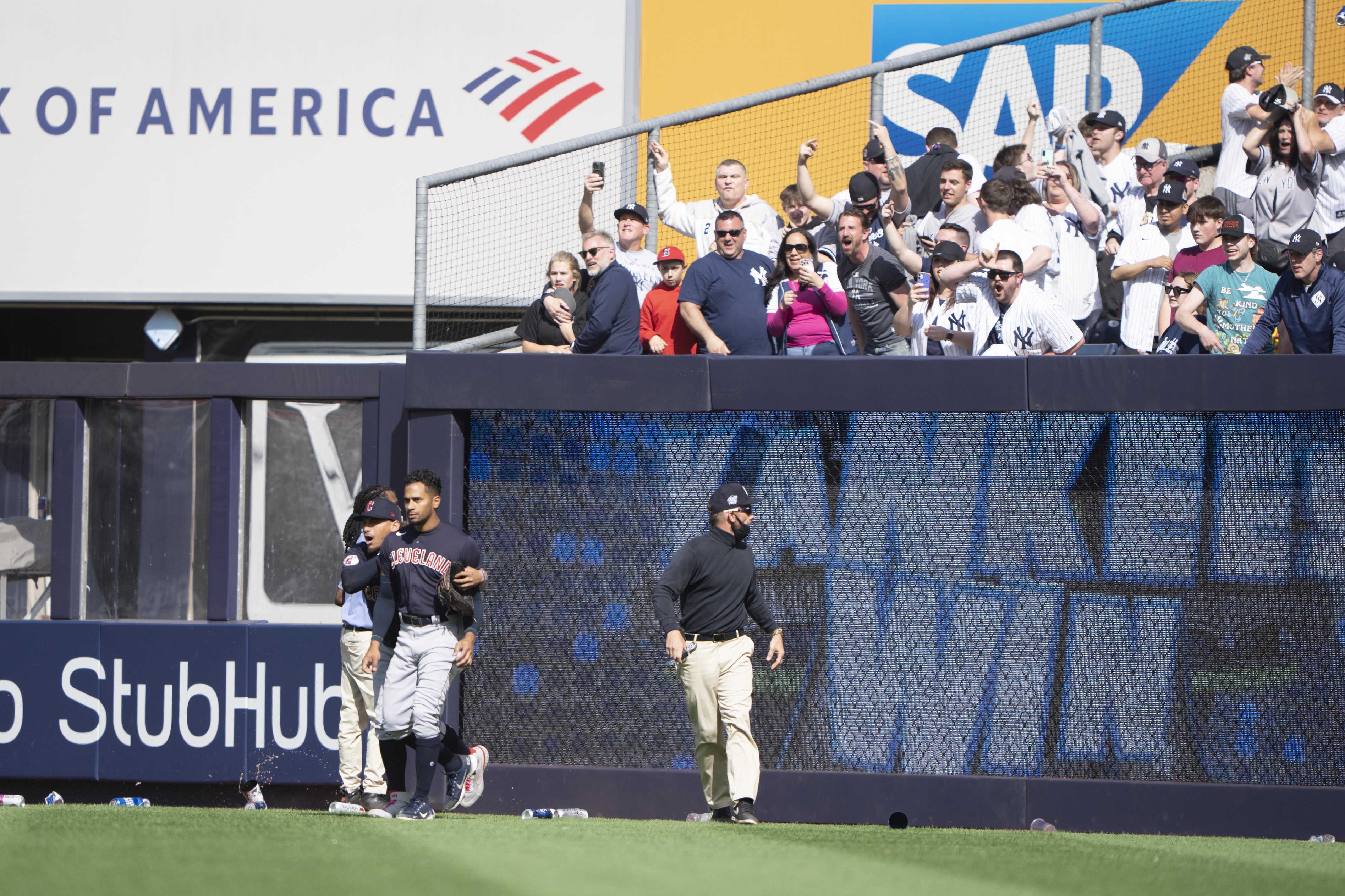 Fans in the right-field bleachers reach out for New York Yankees