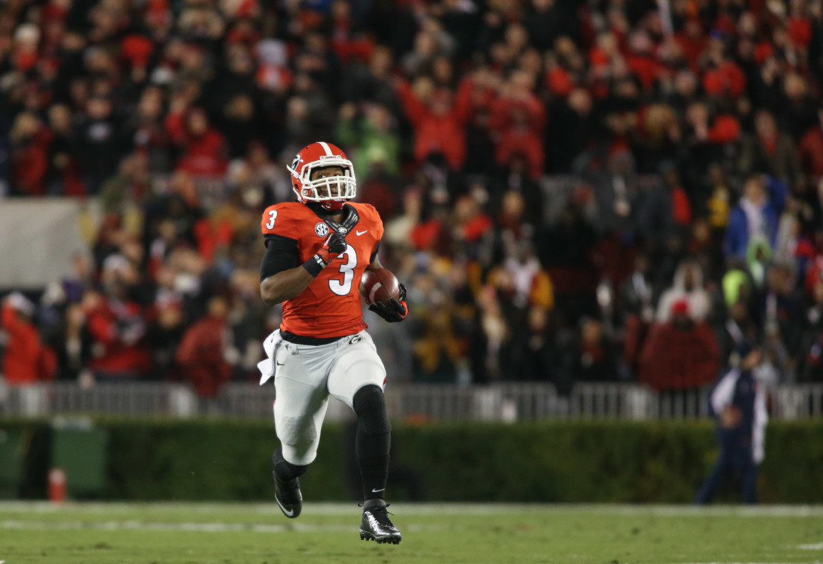 Nov 15, 2014; Athens, GA, USA; Georgia Bulldogs running back Todd Gurley (3) returns a kickoff for a touchdown in the first quarter of their game against the Auburn Tigers at Sanford Stadium. The touchdown was called back due to a holding penalty. Georgia won 34-7. Mandatory Credit: Jason Getz-USA TODAY Sports