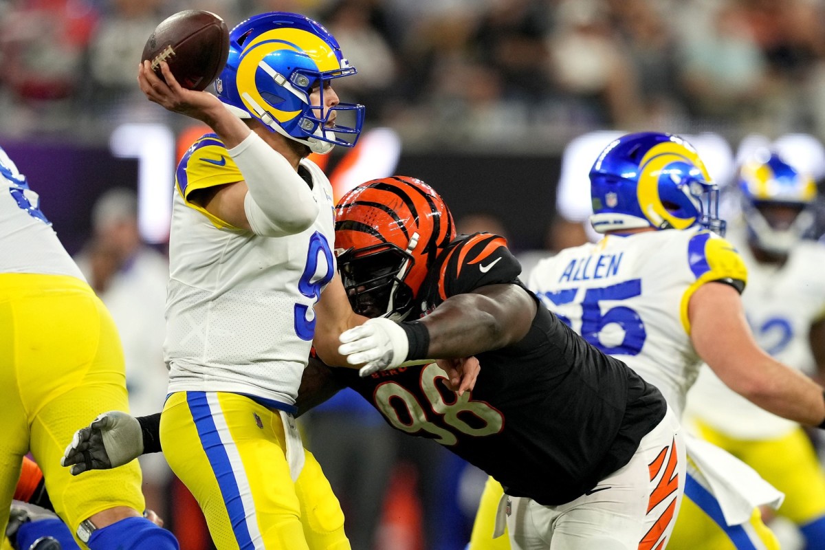 Los Angeles Rams quarterback Matthew Stafford (9) is hit as he throws by Cincinnati Bengals nose tackle D.J. Reader (98) in the third quarter during Super Bowl 56, Sunday, Feb. 13, 2022, at SoFi Stadium in Inglewood, Calif. The Cincinnati Bengals lost, 23-20.