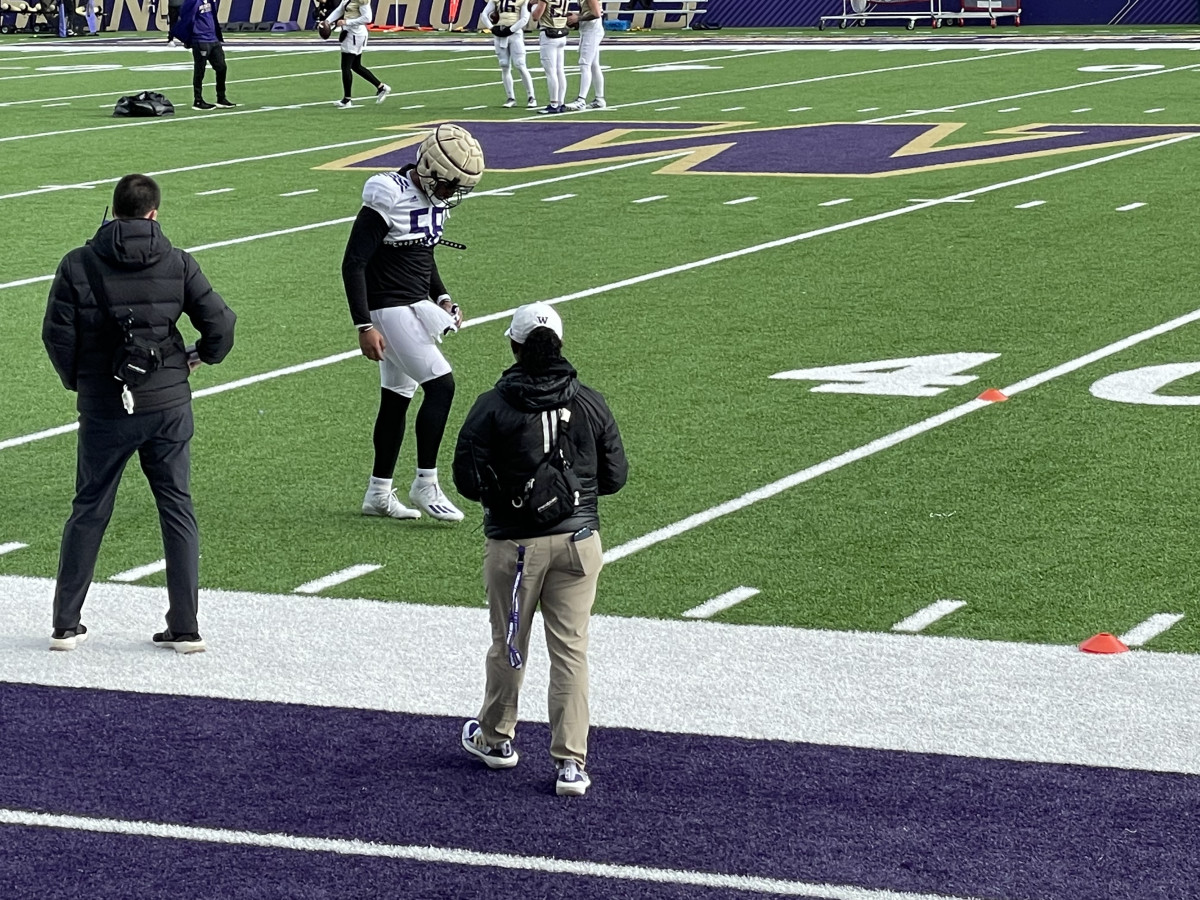 Zion Tupuola-Fetui tests out his foot at practice before returning to drills.