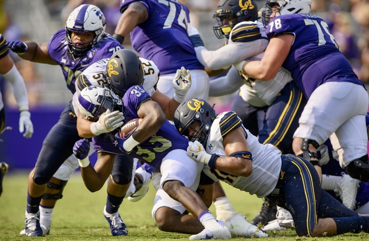 Braxten Croteau (52) takes down TCU ball carrier.