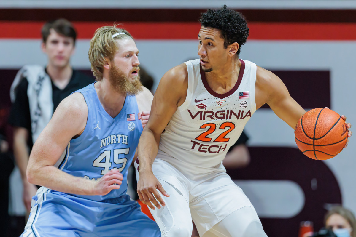 Virginia Tech Hokies forward Keve Aluma (22) is defended by North Carolina Tar Heels forward Brady Malek (45) during the first half at Cassell Coliseum.