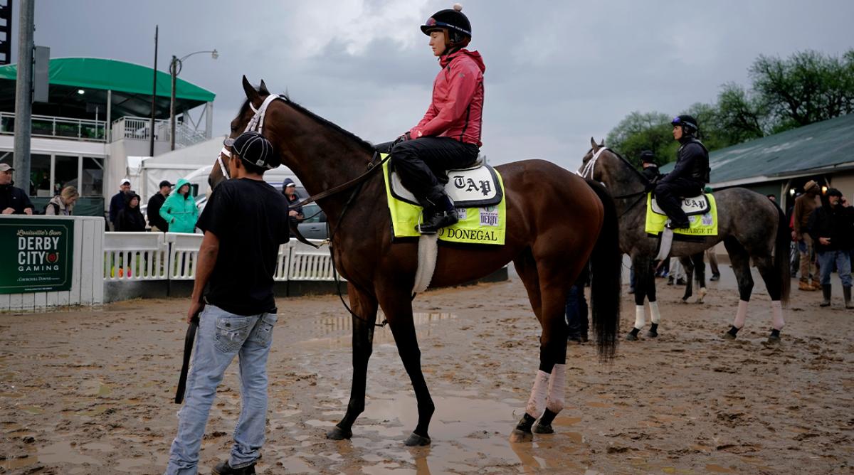 Kentucky Derby entrants Mo Donegal and Charge It wait to go onto the track for a workout at Churchill Downs Tuesday, May 3, 2022, in Louisville, Ky. The 148th running of the Kentucky Derby is scheduled for Saturday, May 7.