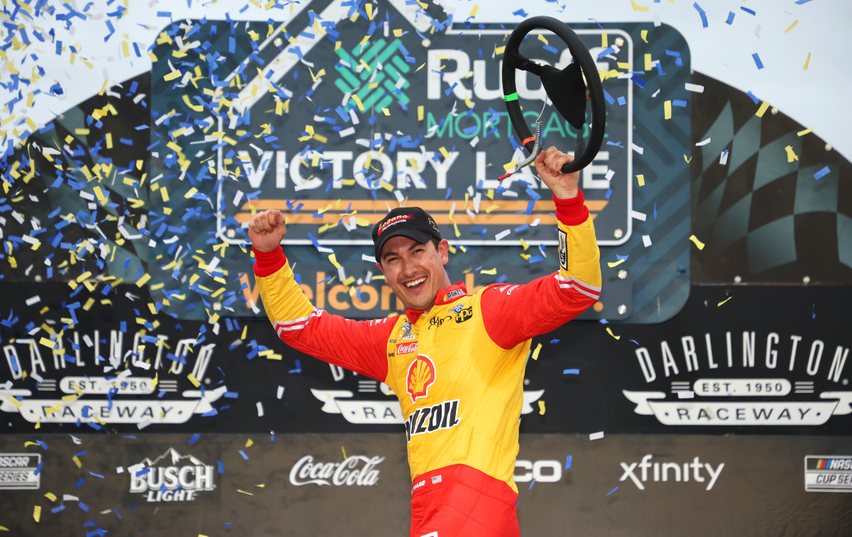 Joey Logano celebrates in victory lane after winning Sunday's Goodyear 400 at Darlington Raceway. (Photo by James Gilbert/Getty Images)