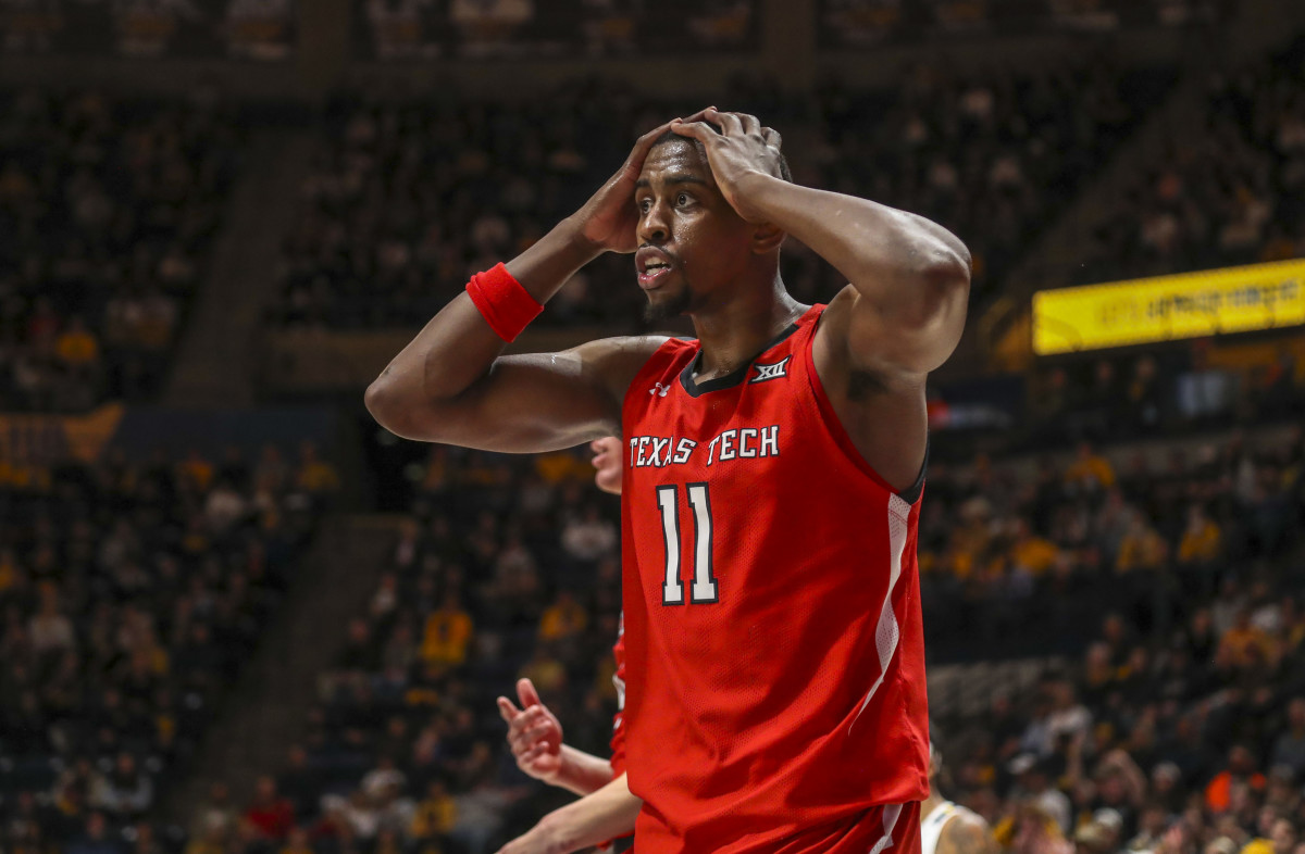 Texas Tech Red Raiders forward Bryson Williams (11) reacts to a call during the second half against the West Virginia Mountaineers at WVU Coliseum.