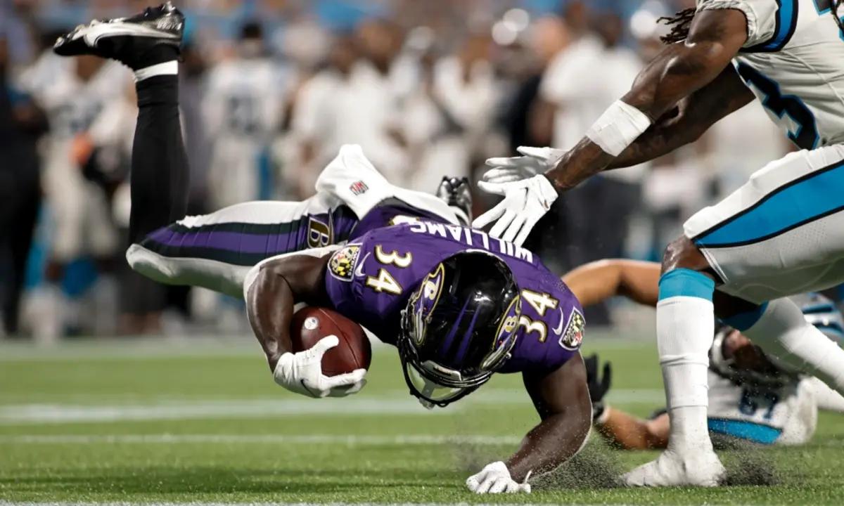 Baltimore Ravens running back Ty'Son Williams (34) pushes through the goal  line to score a two-point conversion against the New Orleans Saints during  the second half of an NFL preseason football game