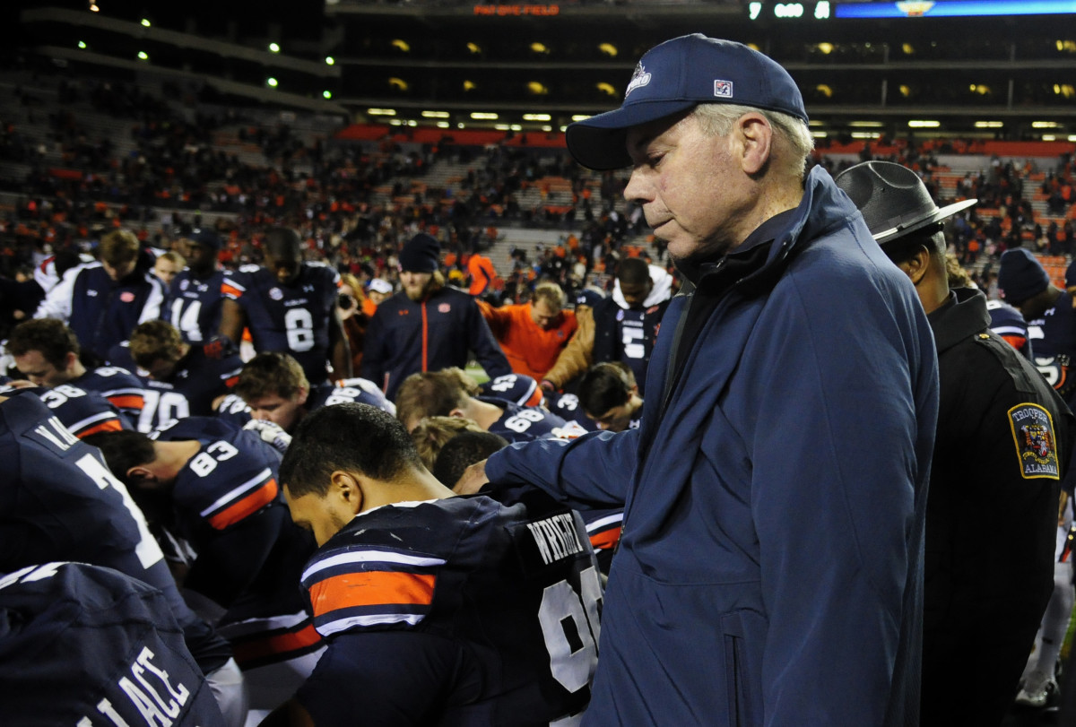 Nov 22, 2014; Auburn, AL, USA; Samford Bulldogs head coach Pat Sullivan joins the team prayer after the game against the Auburn Tigers at Jordan Hare Stadium. Auburn won 31-7.