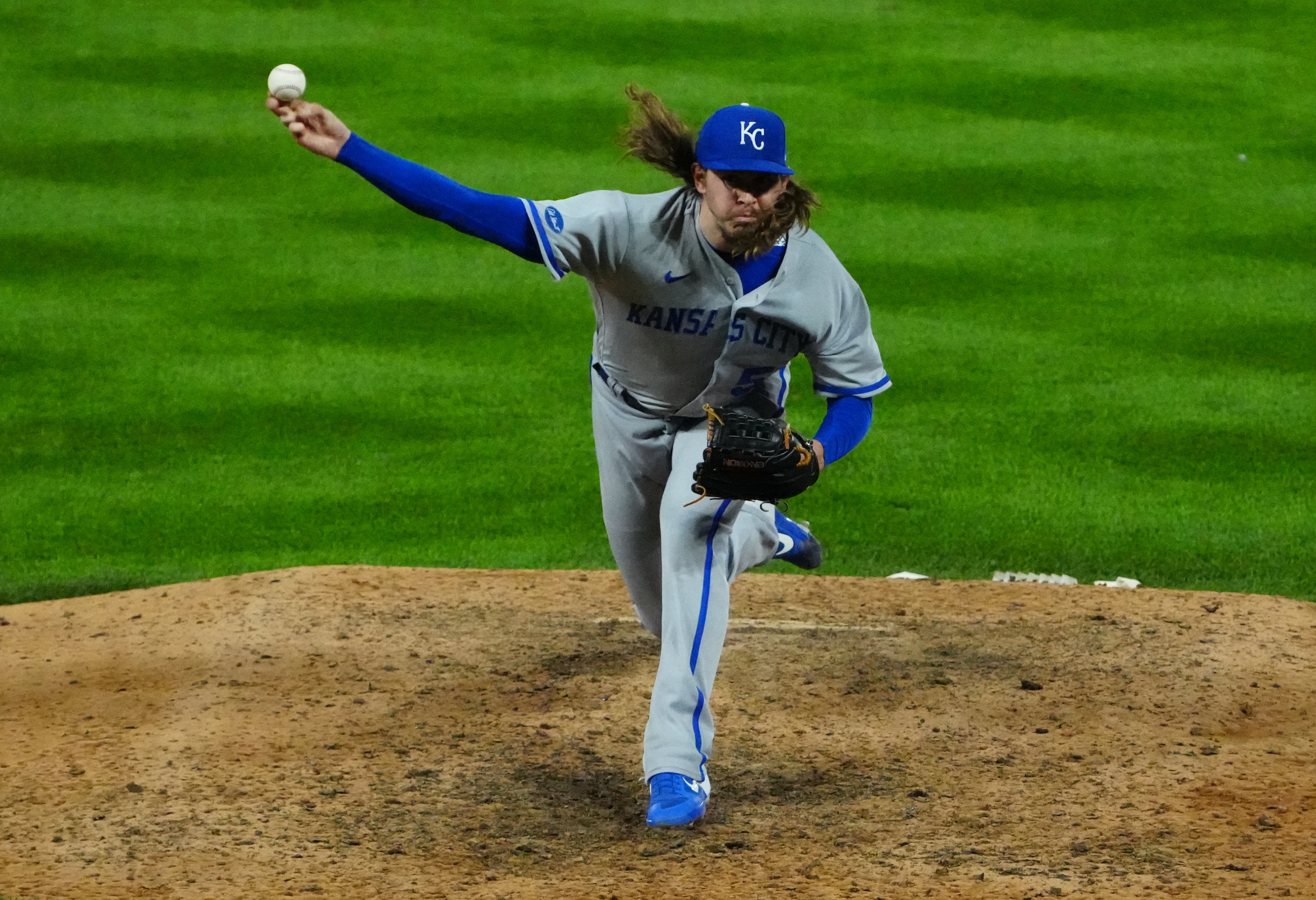 Kansas City Royals fans hold up pictures of starting pitcher