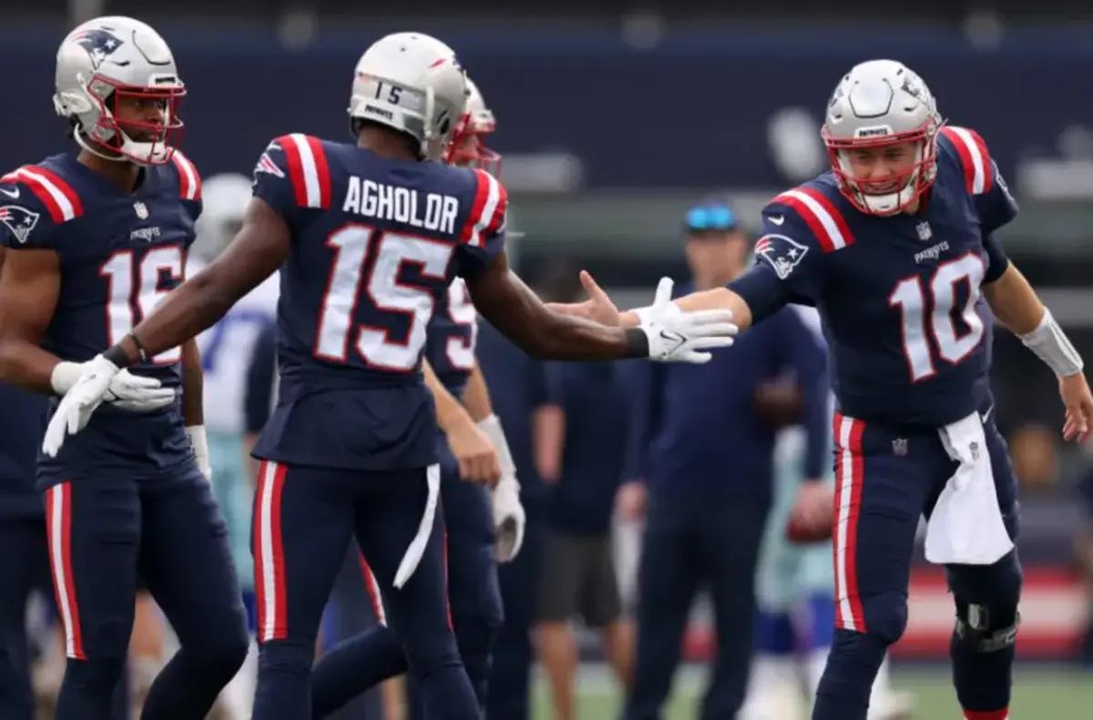 New England Patriots wide receiver Nelson Agholor (15) heads for the end  zone after a touchdown pass from New England Patriots quarterback Mac Jones  during the first half of an NFL football