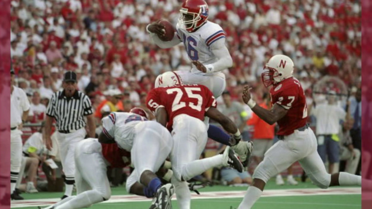 Nebraska's Joe Walker tackles Louisiana Tech's Troy Edwards, 1998