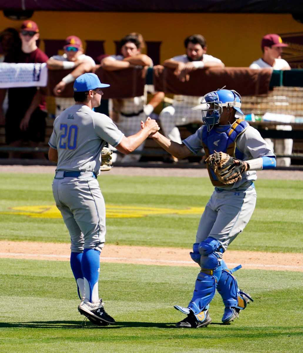 May 29, 2021; Phoenix, Arizona, USA; UCLA pitcher Max Rajcic (20) celebrates after defeating Arizona St. 3-0 at Phoenix Municipal Stadium. Mandatory Credit: Rob Schumacher-Arizona Republic Ncaa Baseball Ucla At Arizona State