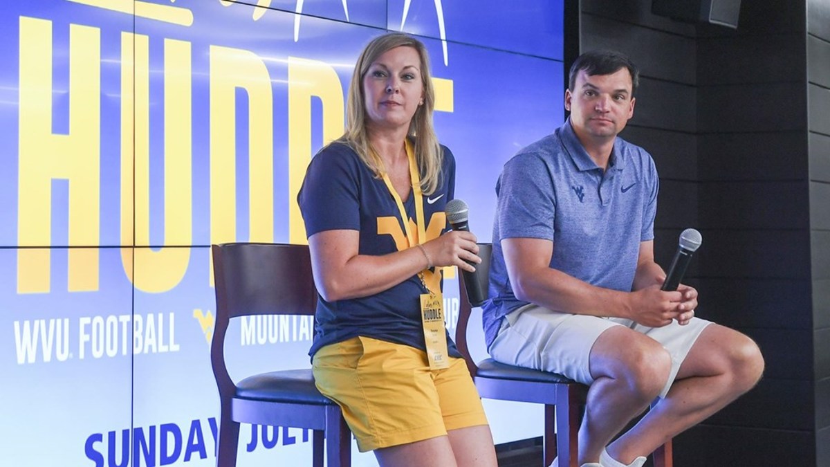 WVU Ladies Huddle. Neal and Brooke Brown