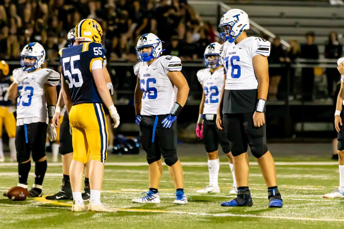 Fletcher Westphal (76) towers over teammates and opponents alike.