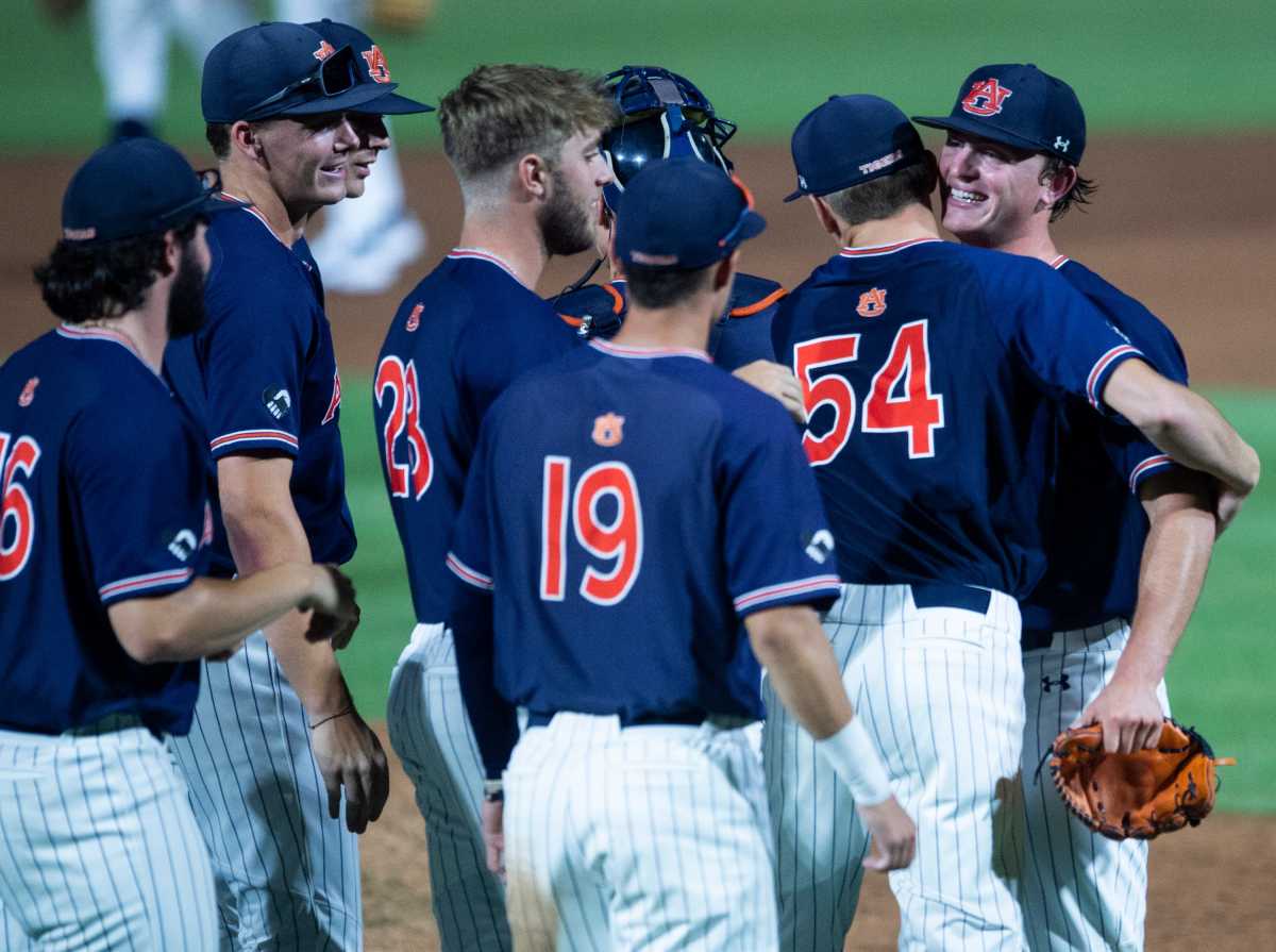 Auburn players celebrate the win during the NCAA regional baseball tournament at Plainsman Park in Auburn, Ala., on Friday, June 3, 2022. Auburn Tigers defeated Southeastern Louisiana Lions 19-7.