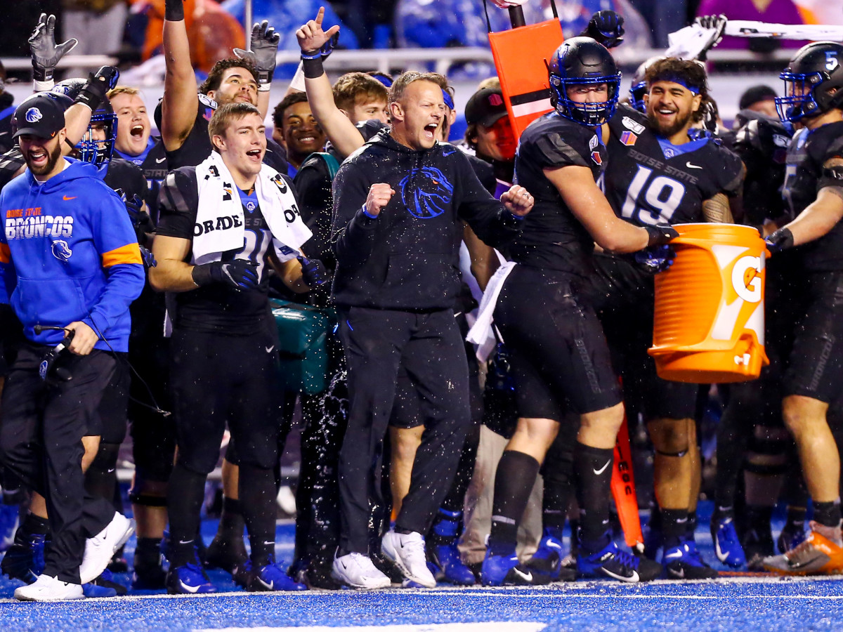 Dec 7, 2019; Boise, ID, USA; Boise State Broncos head coach Bryan Harsin celebrates with his team at the conclusion of the second half of the Mountain West Championship at Albertsons  Stadium versus Hawaii Warriors. Boise State defeats Hawaii 31-10.
