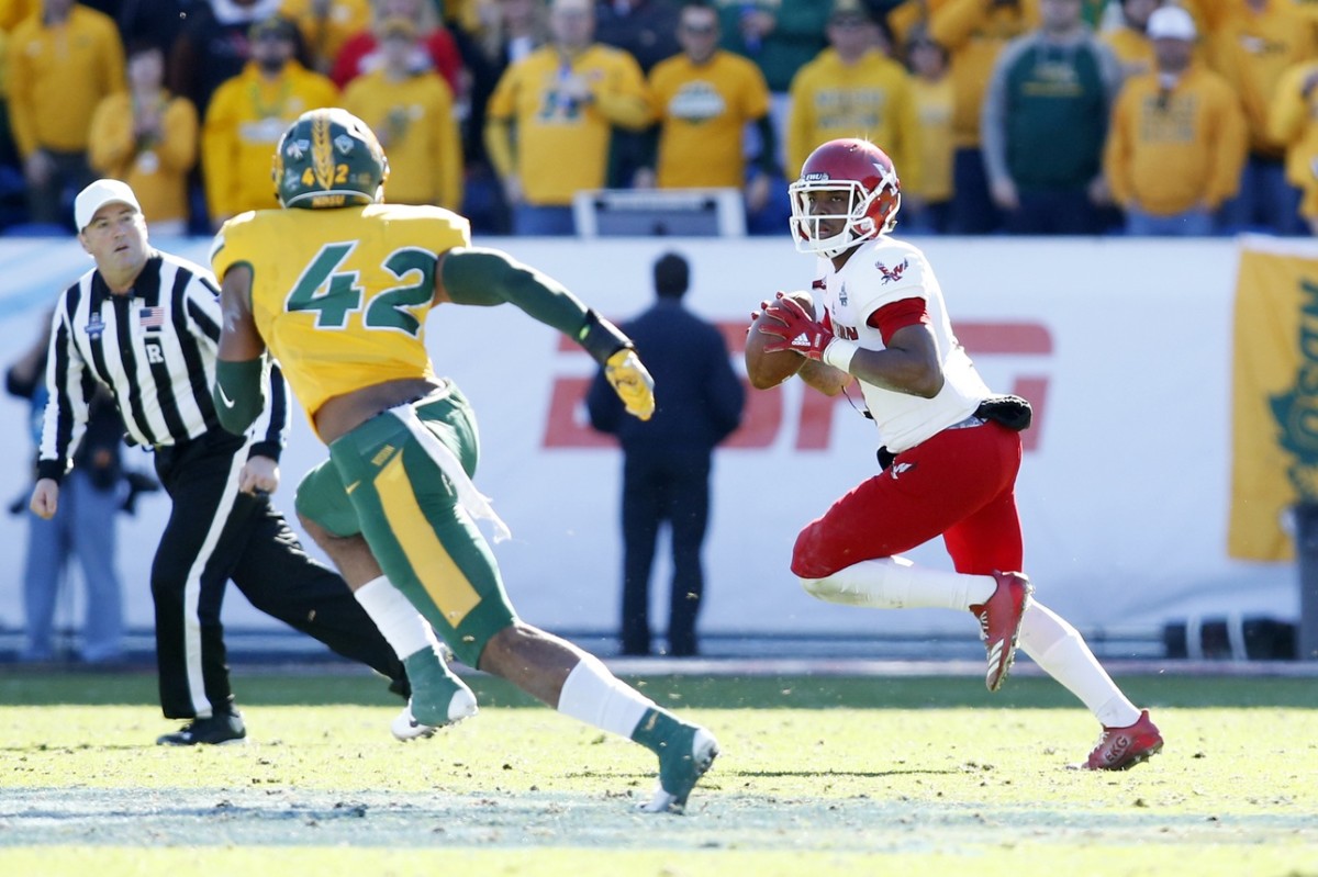 Eastern Washington quarterback Eric Barriere (3) looks to pass against North Dakota State Bison linebacker Jabril Cox (42) in the Division I Football Championship. Mandatory Credit: Tim Heitman-USA TODAY Sports