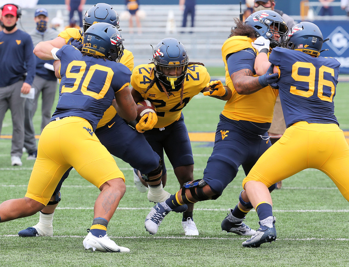 West Virginia running back Tony Mathis Jr looking for a crease during the 2021 Gold and Blue Spring Game