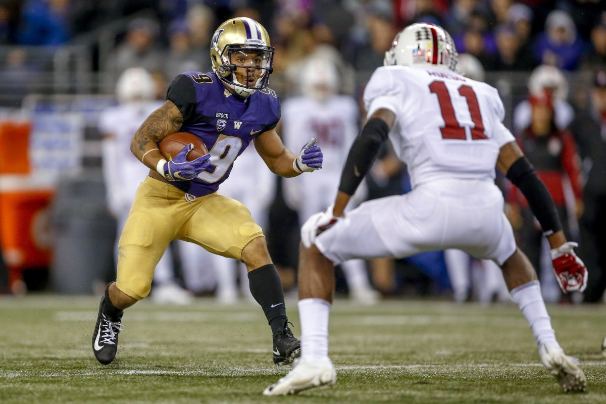 Washington Huskies running back Myles Gaskin (9) runs at Stanford Cardinal cornerback Paulson Adebo (11). Mandatory Credit: Jennifer Buchanan-USA TODAY Sports