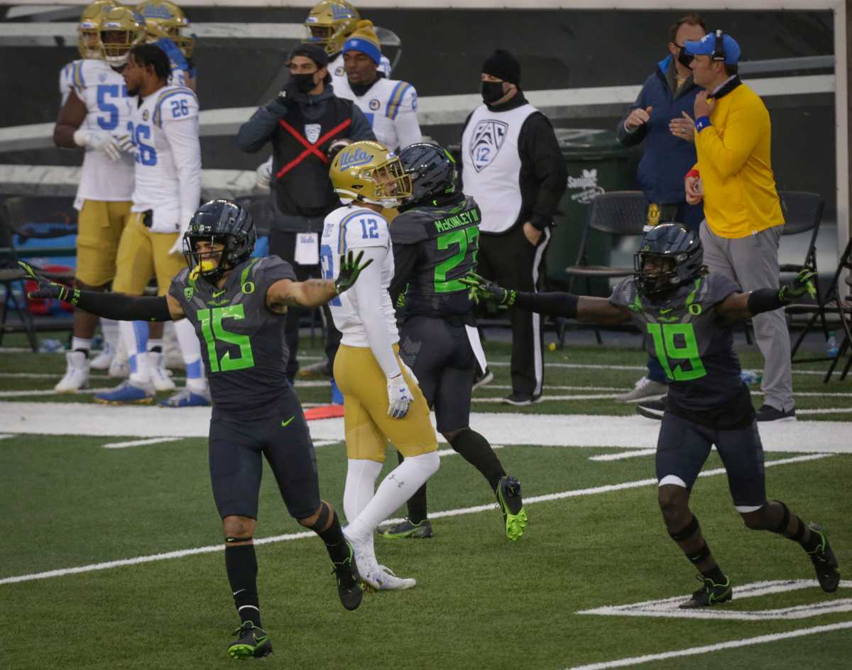 Bennett Williams (15) celebrates an incomplete pass on fourth down against the UCLA Bruins at Autzen Stadium on November 21, 2020. Oregon would hang on to win a thriller 38-35.