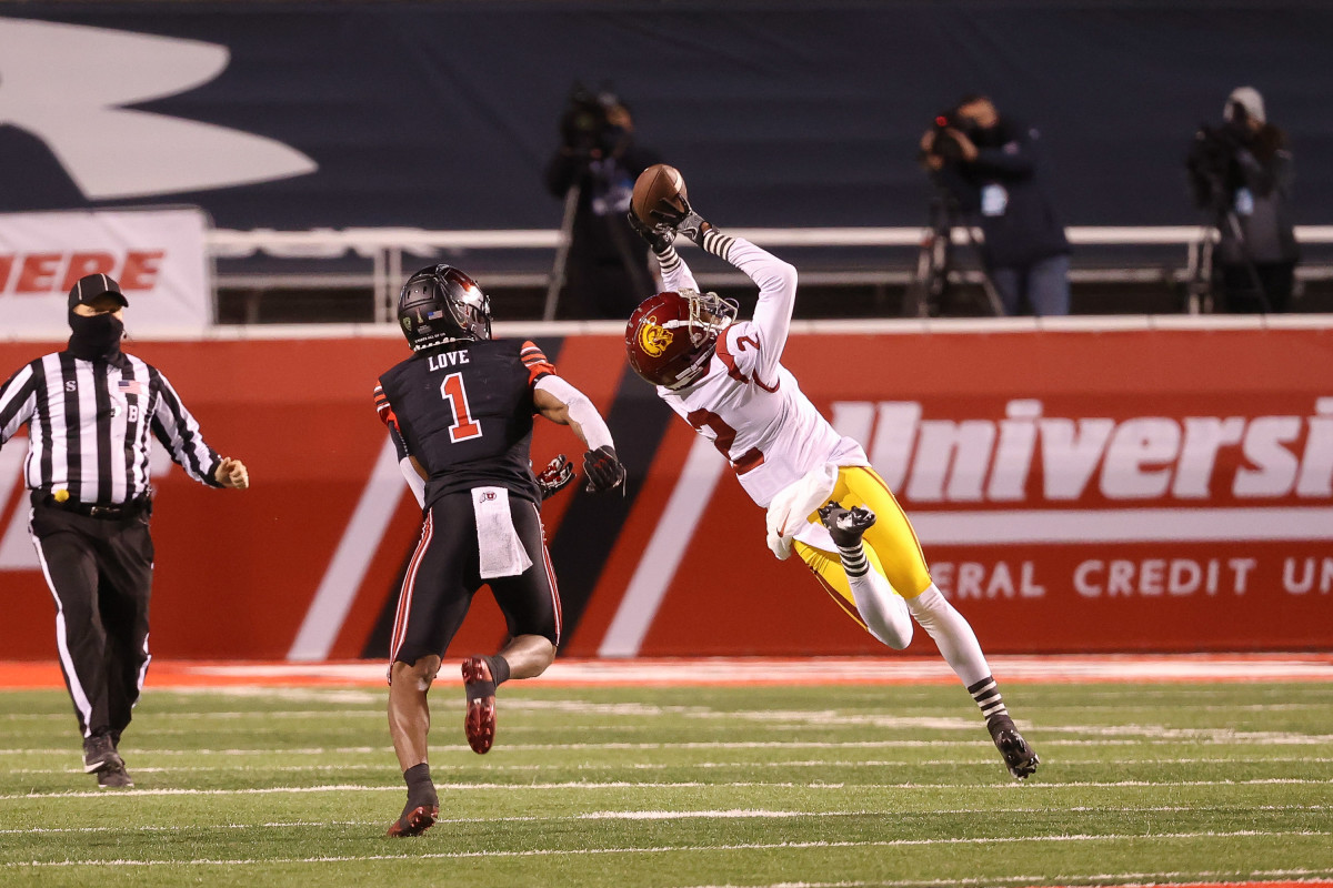 Las Vegas Raiders' Dillon Stoner (16) runs against San Francisco 49ers'  Elijah Mitchell an NFL …