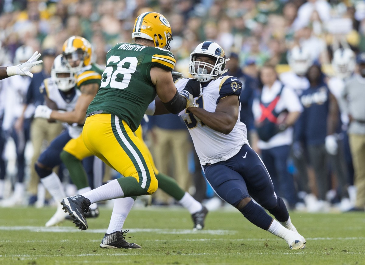 Rams linebacker Ejuan Price (51) is blocked by Green Bay Packers Kyle Murphy (68). Mandatory Credit: Jeff Hanisch-USA TODAY Sports