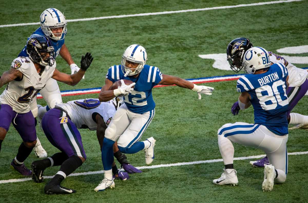 Indianapolis Colts wide receiver DeMichael Harris warms up before