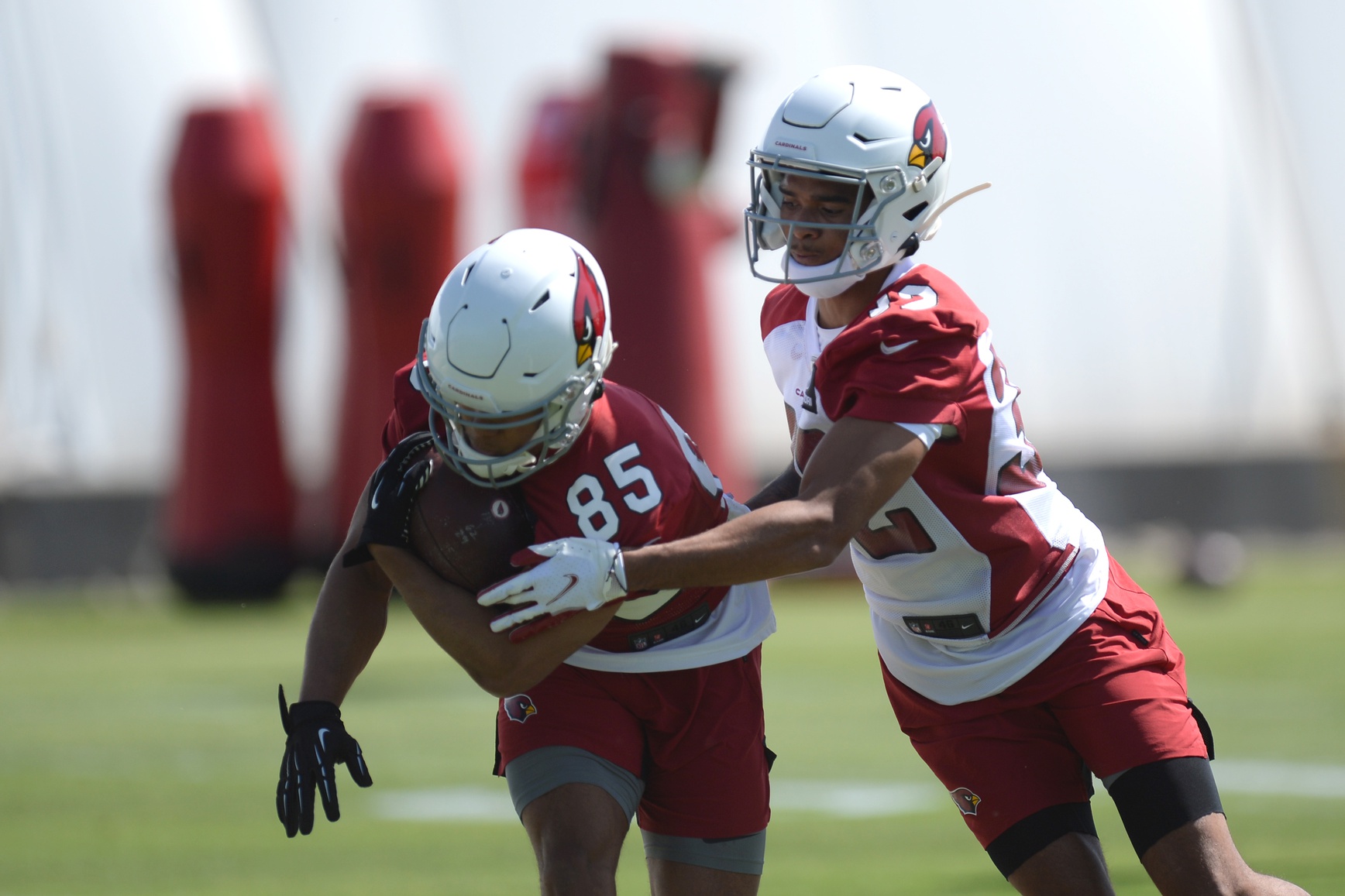 Arizona Cardinals wide receiver Rondale Moore (85) protects the ball from cornerback Tay Gowan (32) during rookie minicamp at Arizona Cardinals Training Facility.