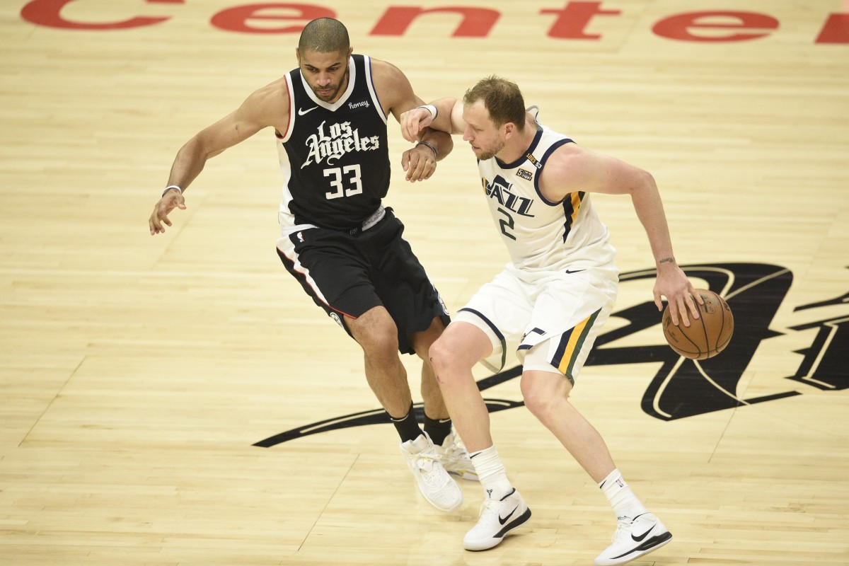 Joe Ingles (2) makes a play against Nicolas Batum (33)