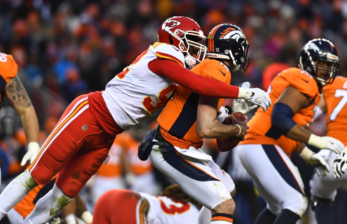 Kansas City Chiefs Tanoh Kpassagnon (92) sacks Denver Broncos quarterback Paxton Lynch (12). Mandatory Credit: Ron Chenoy-USA TODAY