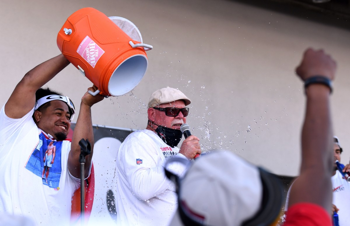 Vita Vea wets down Bruce Arians at the Super Bowl private party.