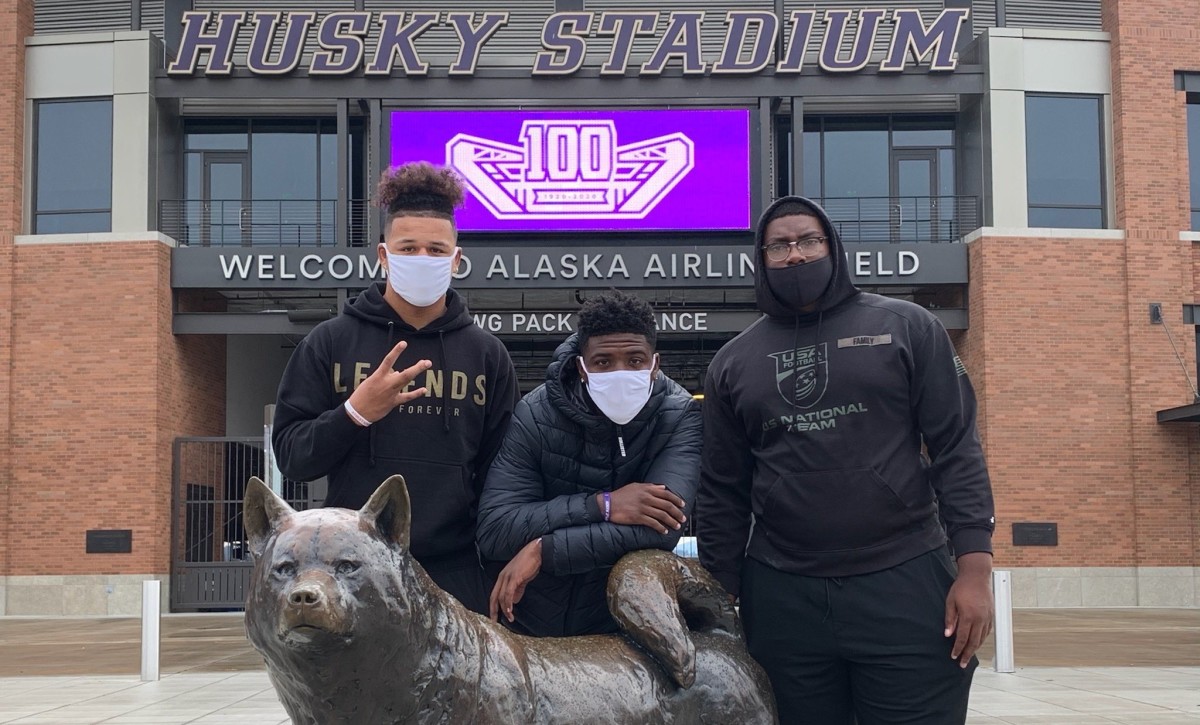 Germie Bernard, center, shares a Husky moment with Anthony Jones and Sir Mells, who will play at Texas and Oregon.