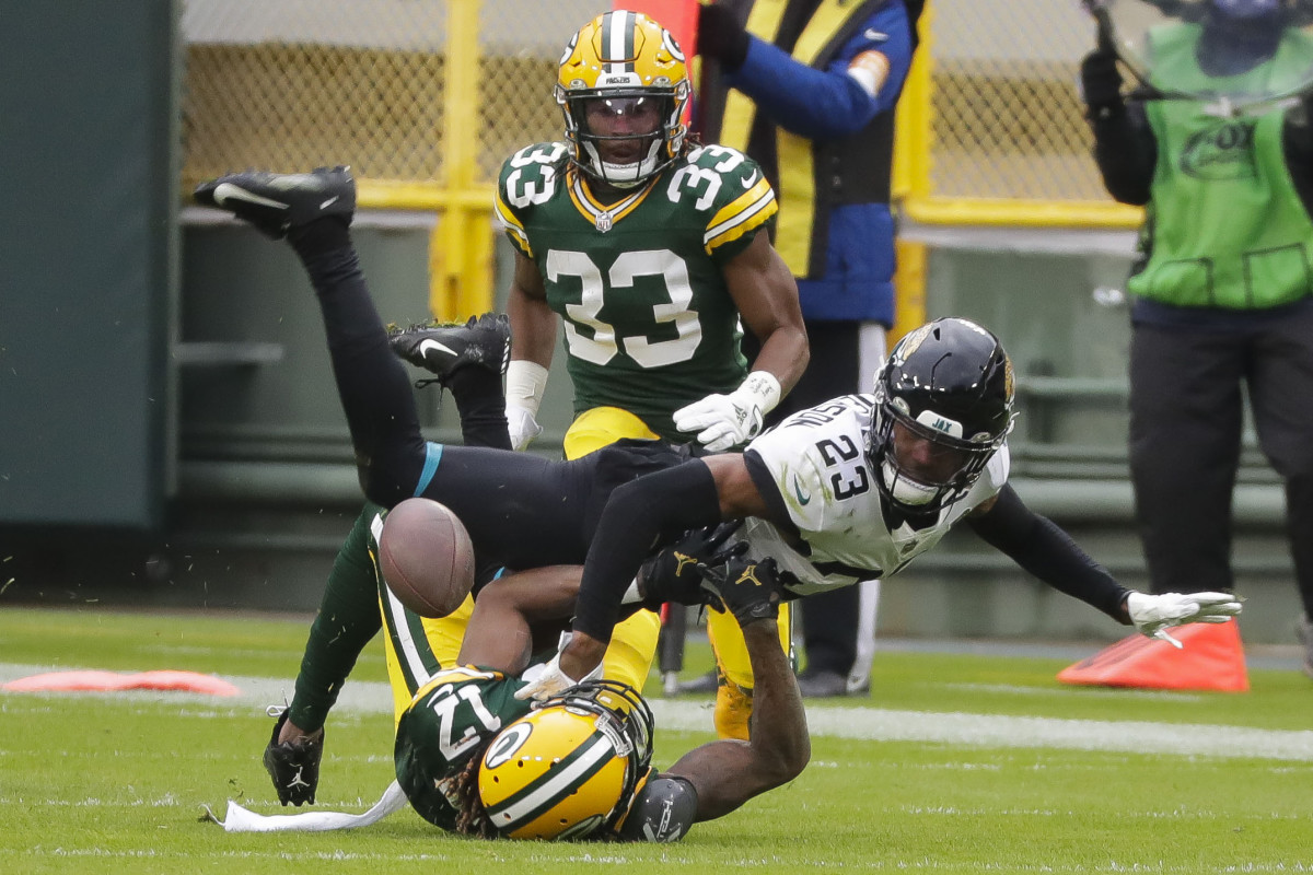 Henderson (23) forces a fumble versus the Packers in 2020. Mandatory Credit: Tork Mason/USA TODAY NETWORK-Wisconsin