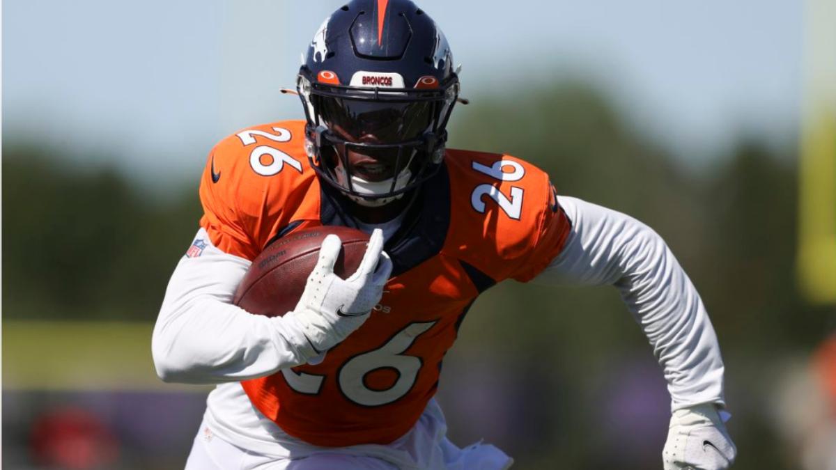 Denver Broncos running back Mike Boone (26) runs against Minnesota