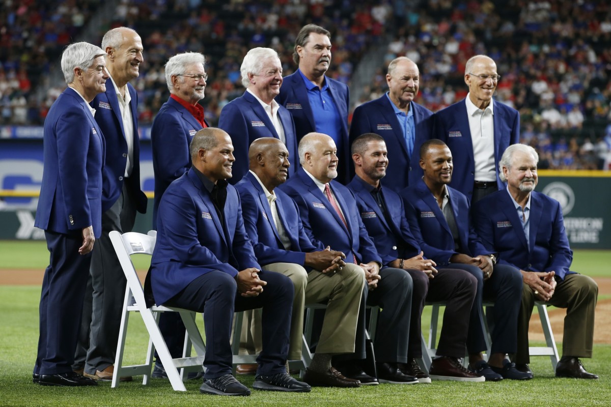 Aug 14, 2021; Arlington, Texas, USA; Former Texas Rangers Hall of Fame members pose for a photo after the induction ceremony before the game against the Oakland Athletics at Globe Life Field.