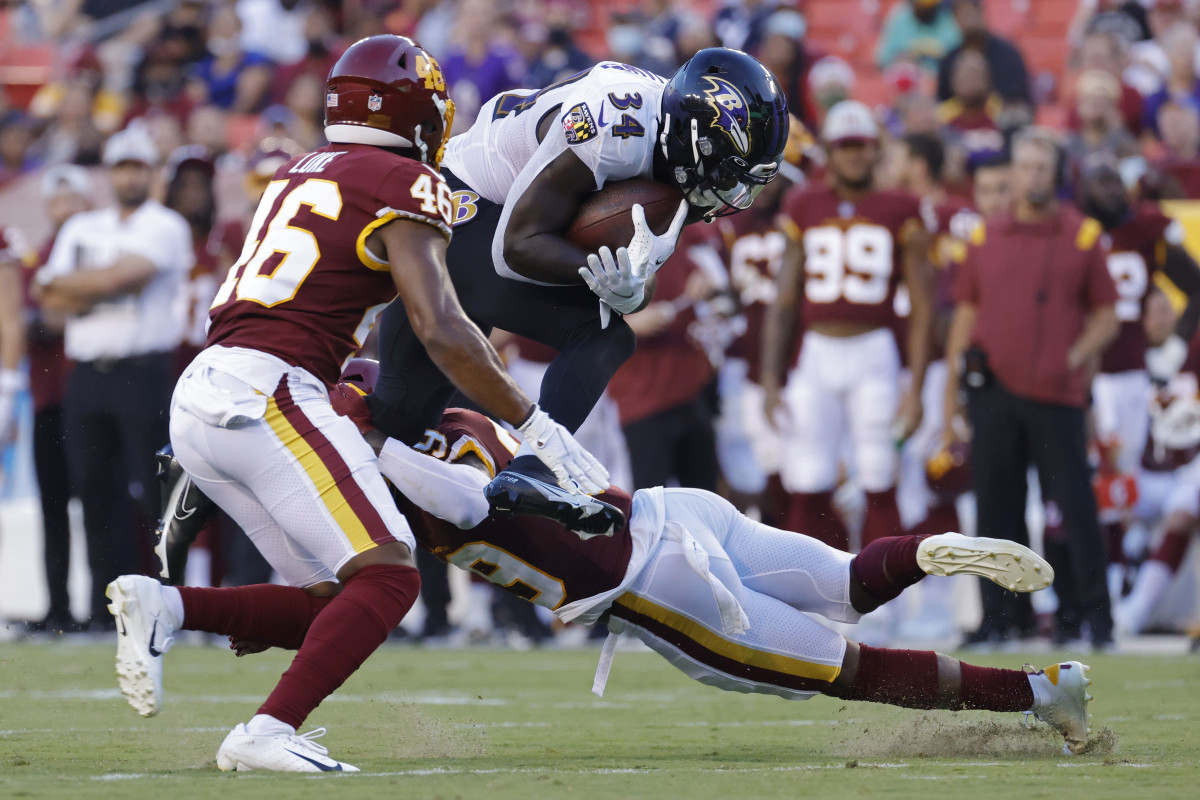 Baltimore Ravens running back Ty'Son Williams (34) pushes through the goal  line to score a two-point conversion against the New Orleans Saints during  the second half of an NFL preseason football game