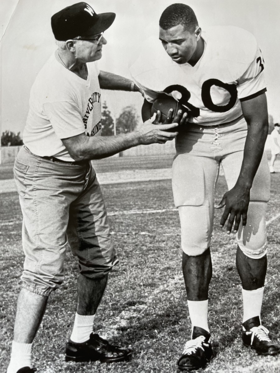 UW assistant coach Chesty Walker works with Junior Coffey.