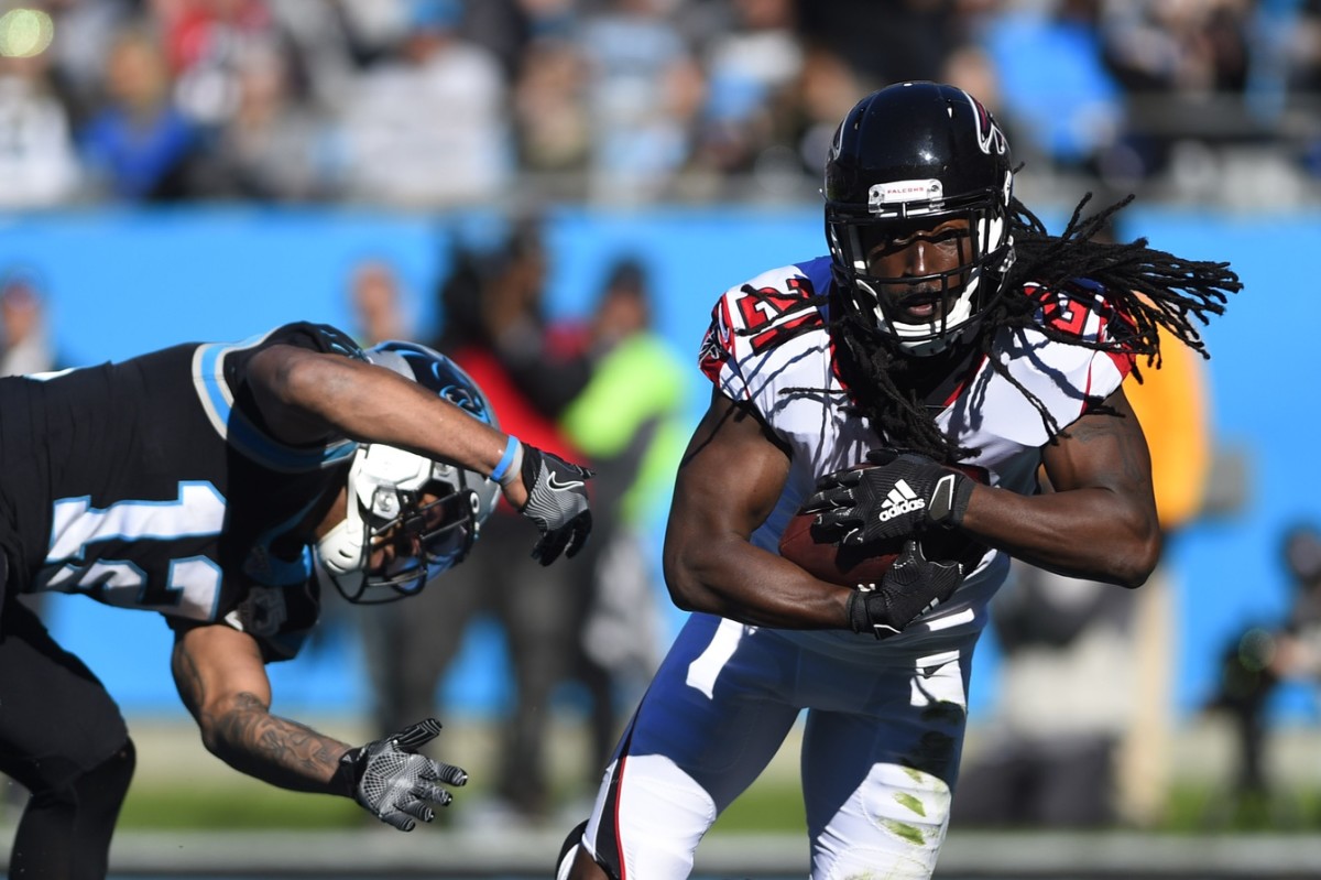 Atlanta Falcons cornerback Desmond Trufant (21) intercepts a pass intended for Carolina receiver D.J. Moore (12). Mandatory Credit: Bob Donnan-USA TODAY Sports