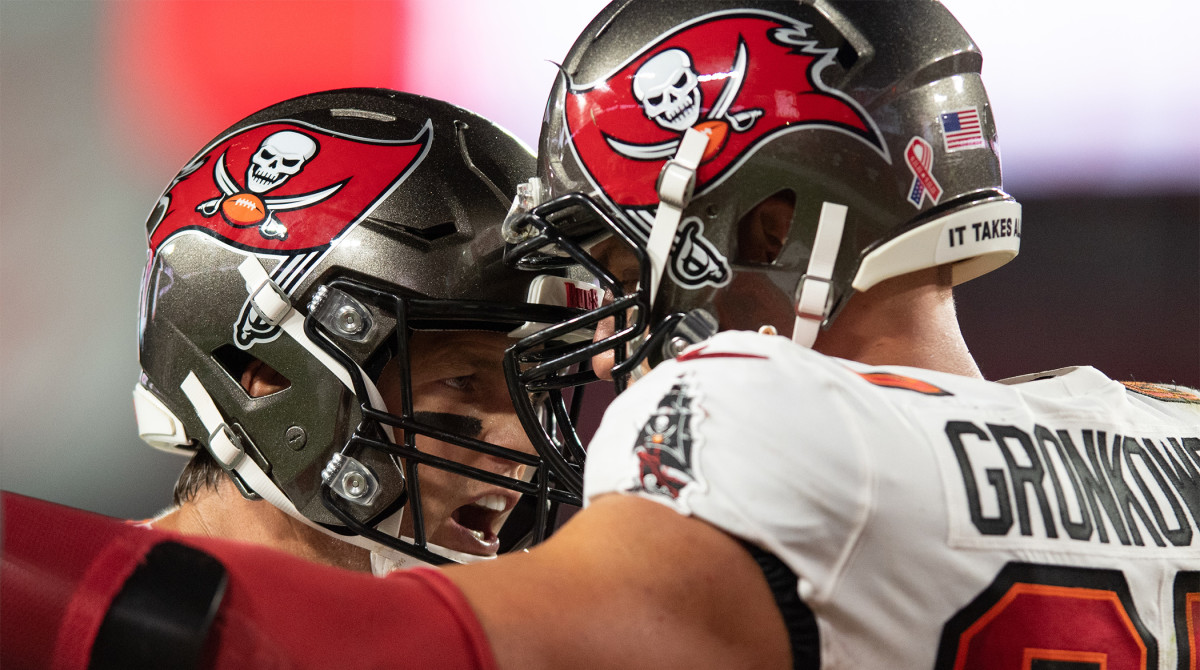 Sep 9, 2021; Tampa, Florida, USA; Tampa Bay Buccaneers quarterback Tom Brady (12) and tight end Rob Gronkowski (87) celebrate after a touchdown against the Dallas Cowboys in the second quarter at Raymond James Stadium.