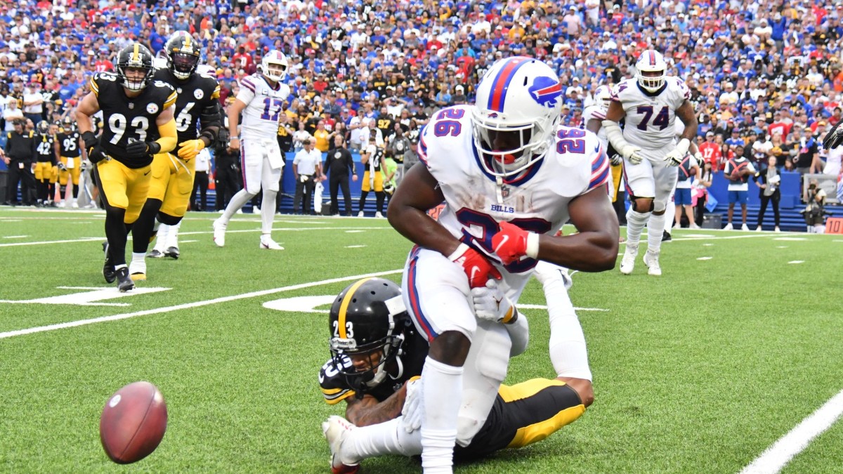 Buffalo Bills running back Devin Singletary (26) runs with the ball during  the first half of an NFL football game against the Pittsburgh Steelers in  Orchard Park, N.Y., Sunday, Oct. 9, 2022. (