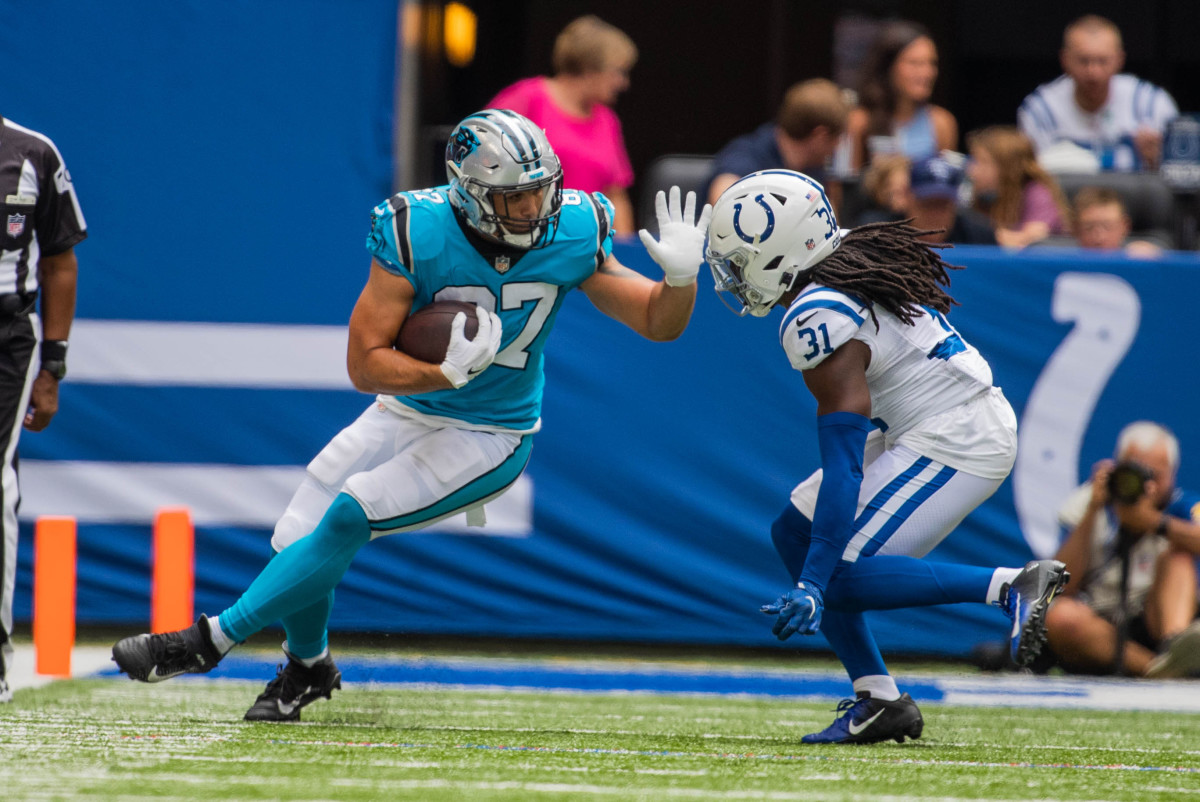 Aug 15, 2021; Indianapolis, Indiana, USA; Carolina Panthers tight end Giovanni Ricci (87) runs with the ball while Indianapolis Colts safety Shawn Davis (31) defends in the second half at Lucas Oil Stadium.