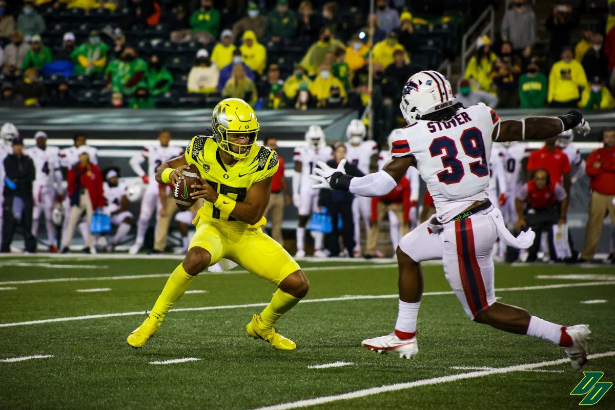 Thompson runs against Stony Brook during his college debut.